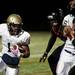 Chelsea senior tailback Berkley Edwards runs against Chelsea defenders on Friday. Daniel Brenner I AnnArbor.com